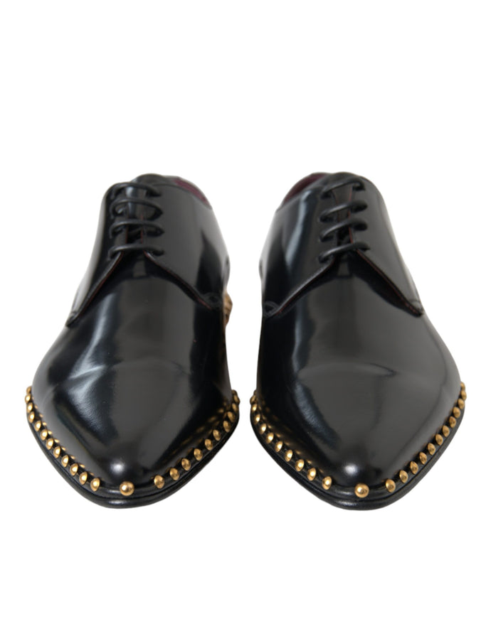 Front view of Dolce & Gabbana black leather shoes with gold studs