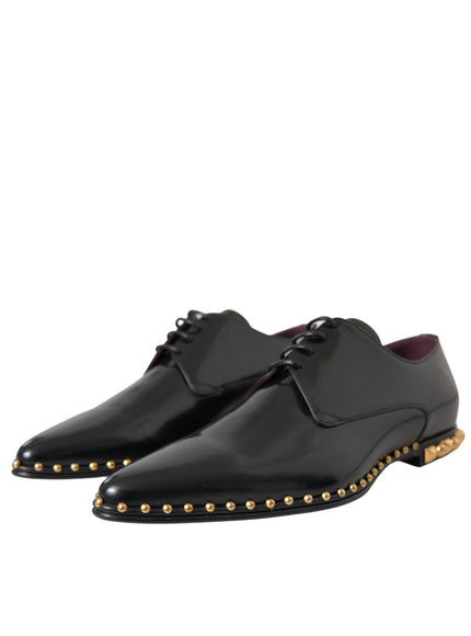 Angled view of Dolce & Gabbana black leather shoes with gold studs