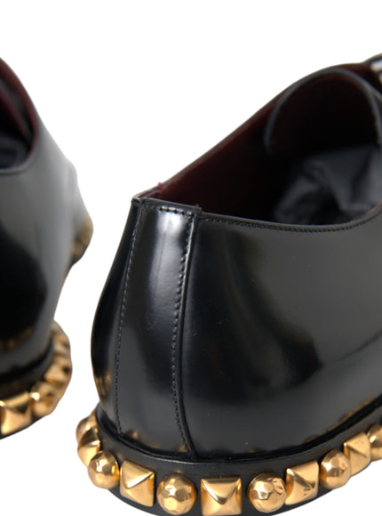 Close-up of gold studs on Dolce & Gabbana black leather shoes