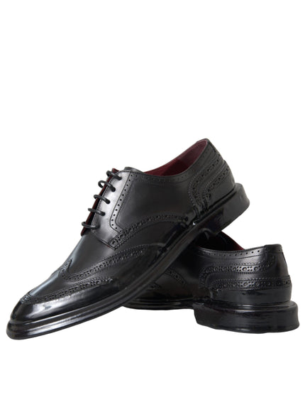 Pair of Dolce & Gabbana black Oxford wingtip shoes stacked