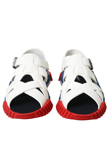 a pair of white sandals with red soles