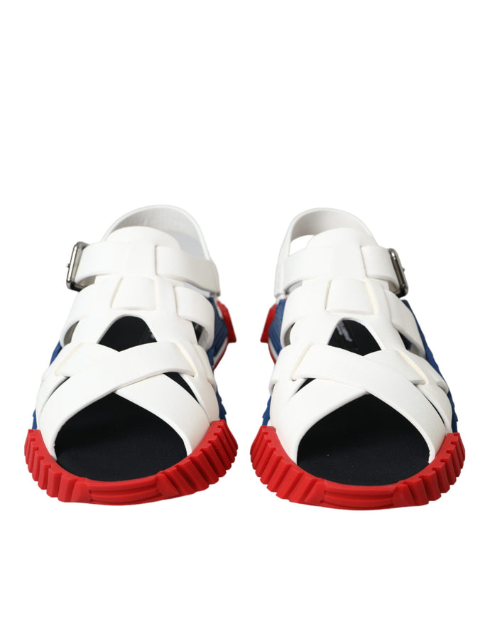 a pair of white sandals with red soles