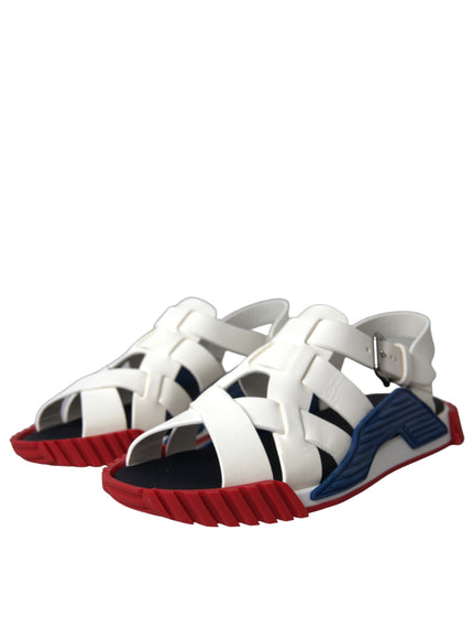 a pair of white and blue sandals with red soles