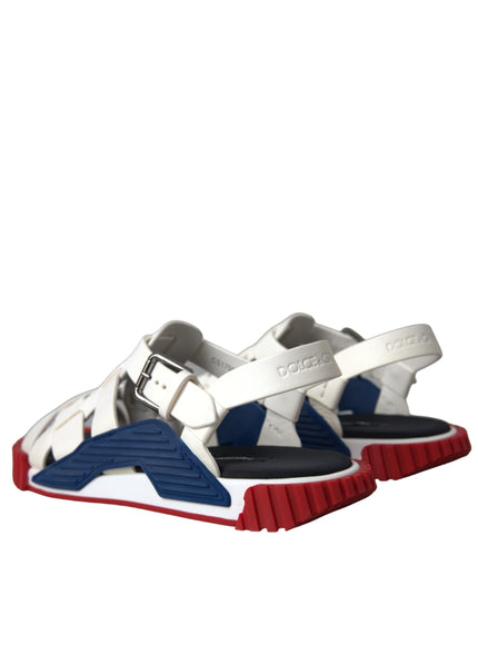 a pair of white and blue shoes with red soles