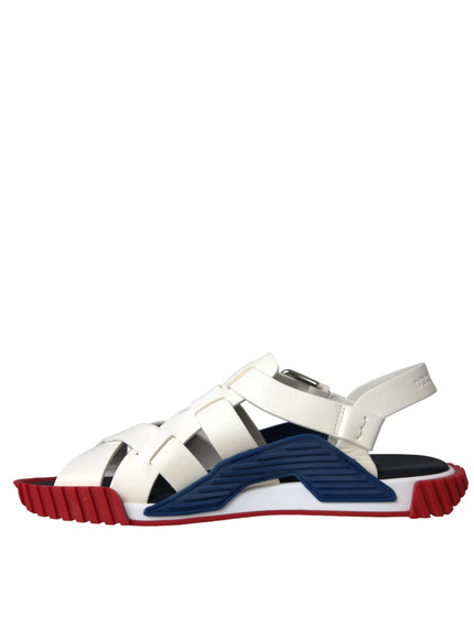 a white and blue sandal with red soles