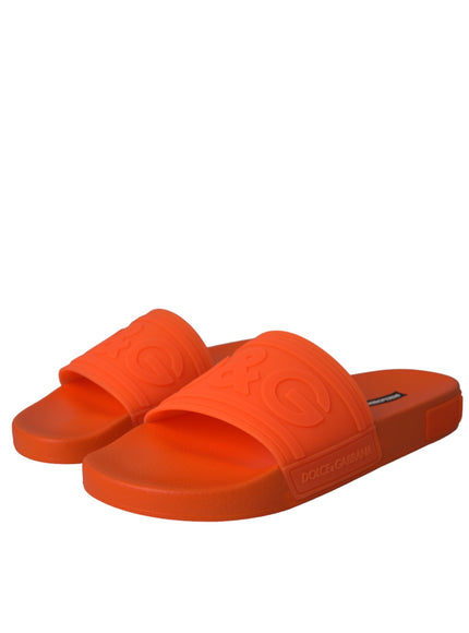 Angled view of Dolce & Gabbana orange rubber slides