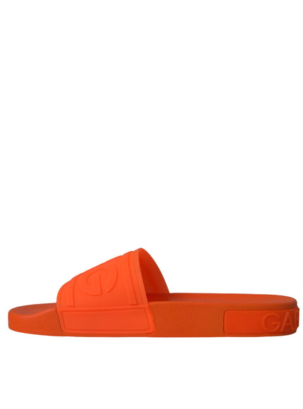 Side view of Dolce & Gabbana orange rubber slide sandal