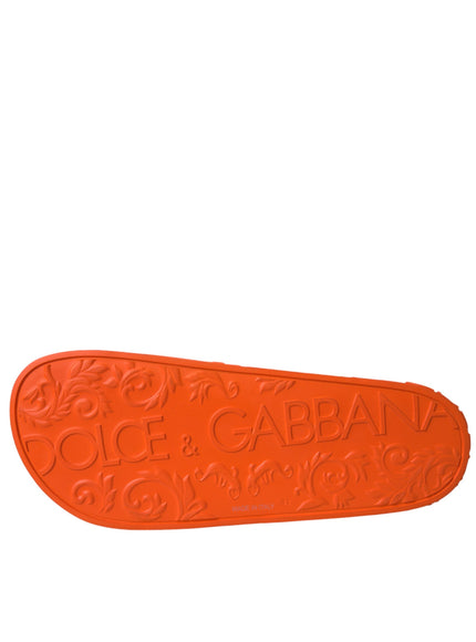 Sole view of Dolce & Gabbana orange rubber slide sandal