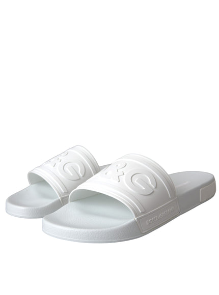 Angled view of Dolce & Gabbana white rubber slides