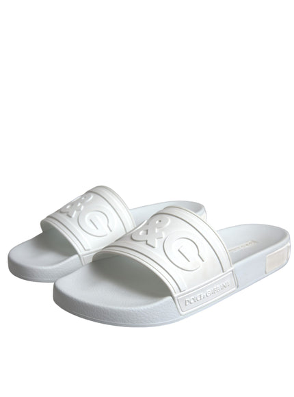 Angled view of Dolce & Gabbana white rubber slides