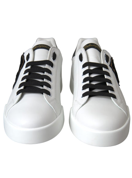 a pair of white shoes with black laces