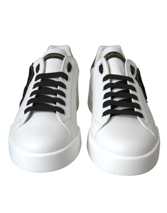 a pair of white shoes with black laces