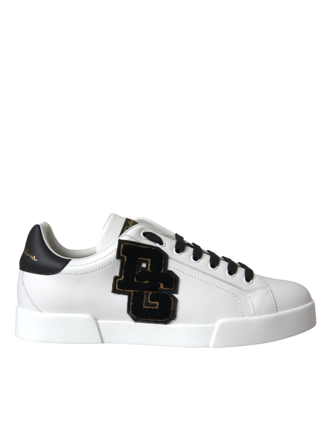 a white sneaker with a black and gold logo