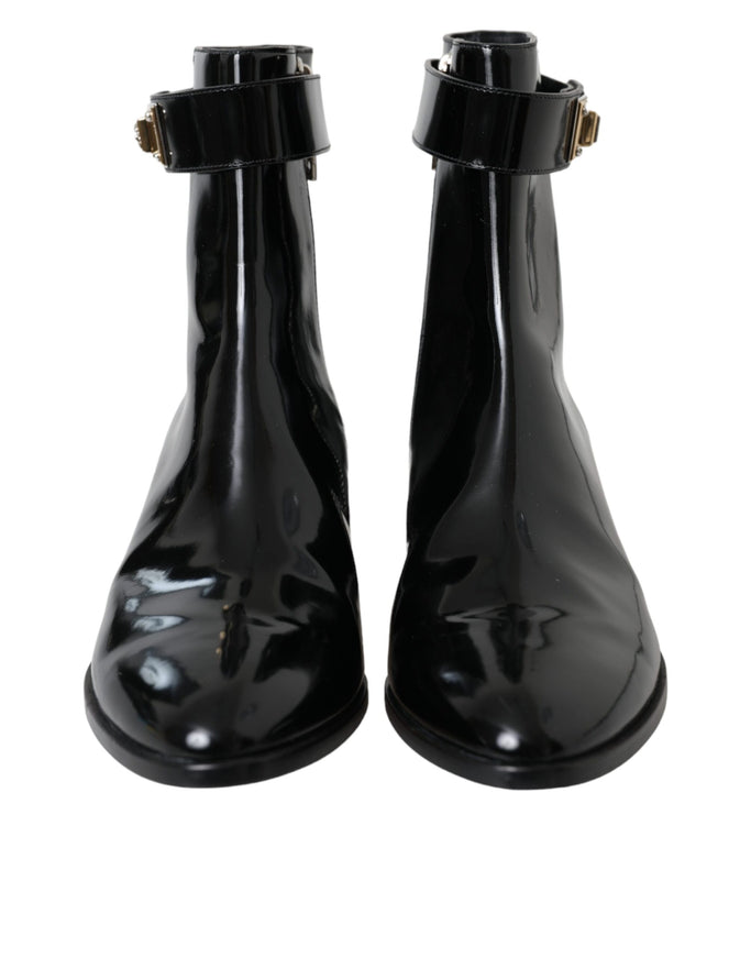 Front view of Dolce & Gabbana black leather ankle boots