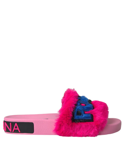 a pink and blue furry slipper with a logo on it