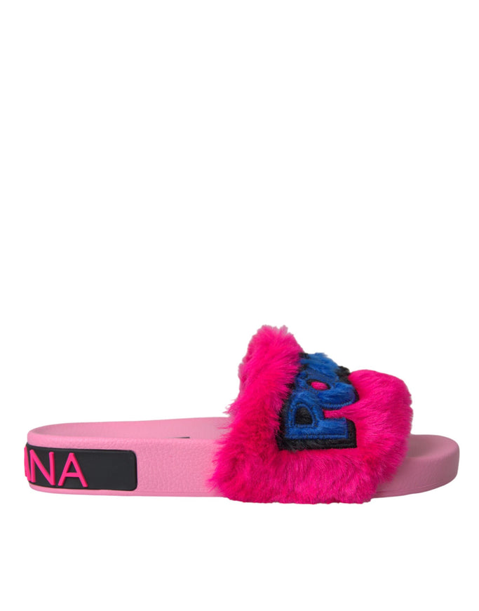 a pink and blue furry slipper with a logo on it