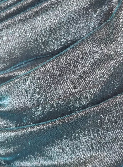 Close-up of turquoise satin fabric texture