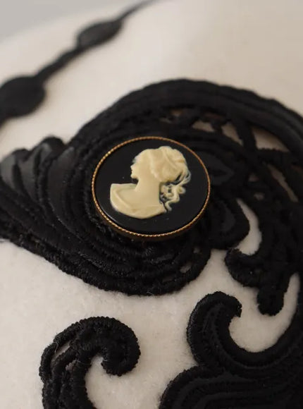 Detail of black embroidery and cameo on Dolce & Gabbana hat