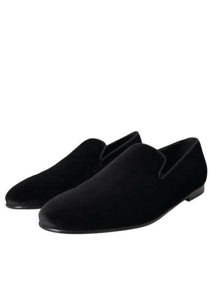 a pair of black shoes on a white background