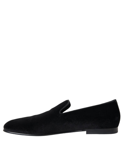 a pair of black shoes on a white background