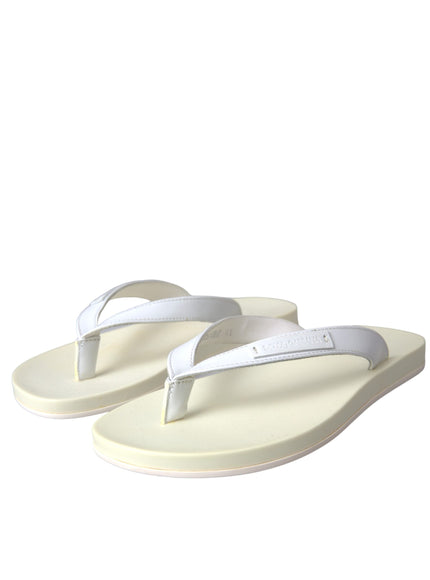 a pair of white sandals on a white background