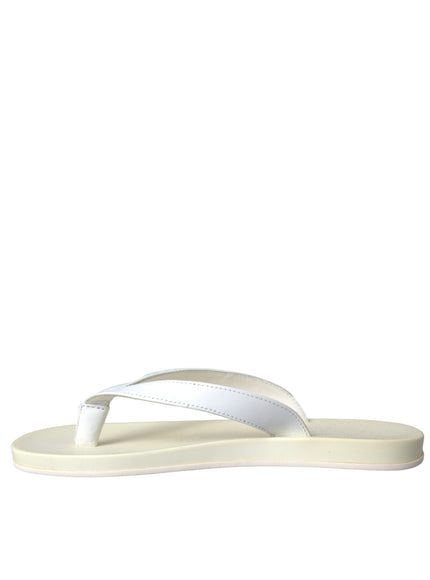 a pair of white sandals on a white background