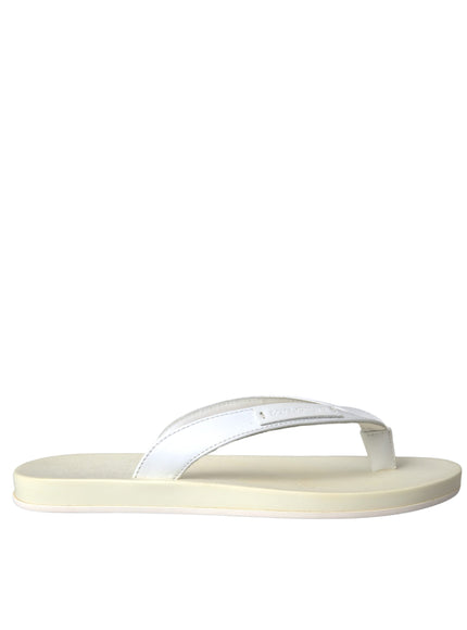 a pair of white sandals on a white background