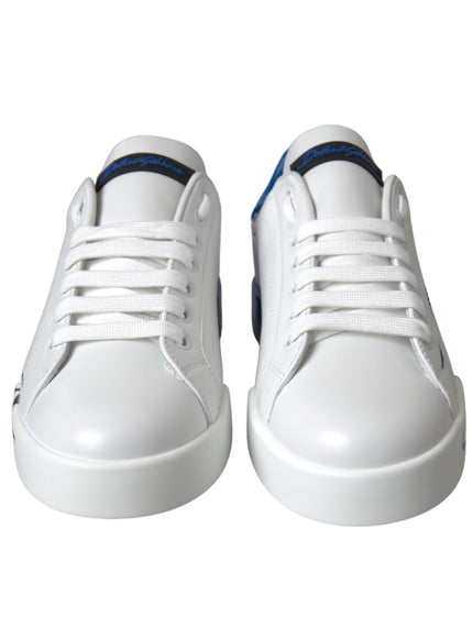 a pair of white shoes with blue detailing