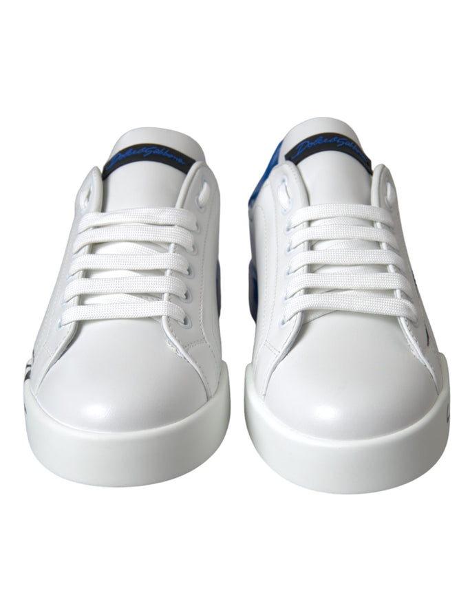 a pair of white shoes with blue detailing