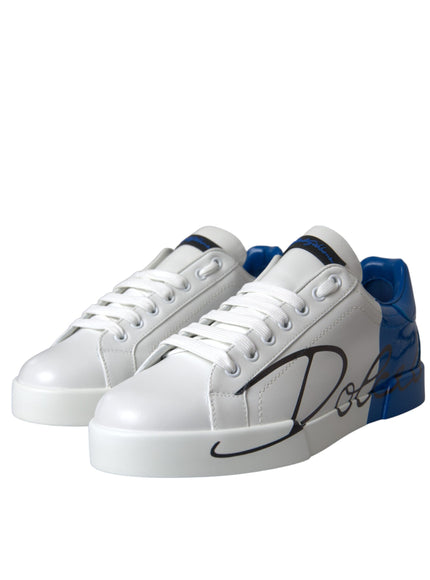 a pair of white sneakers with blue and black detailing