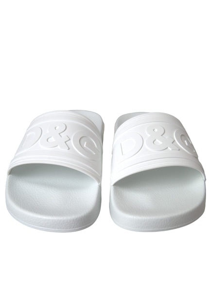 a pair of white slippers on a white background