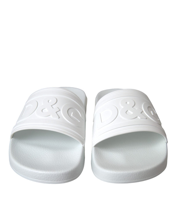 a pair of white slippers on a white background