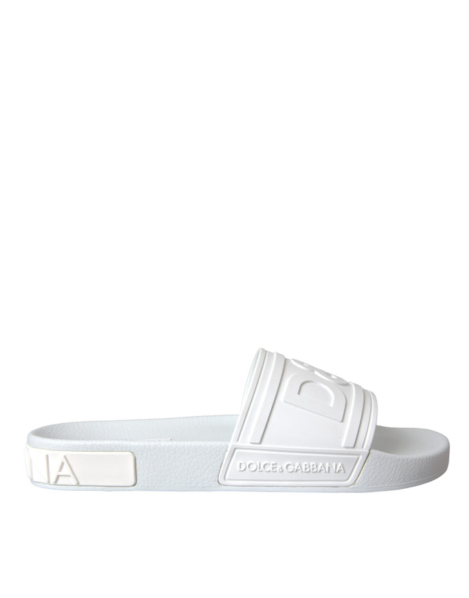 a white slider sandal with a logo on the side