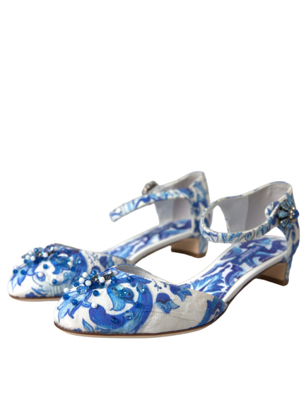 a pair of blue and white shoes on a white background