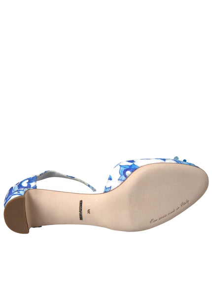 a woman's shoe with a blue flower on the heel