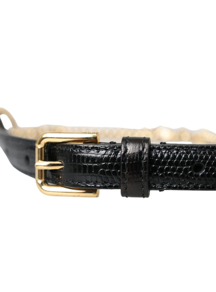 a black belt with a gold buckle