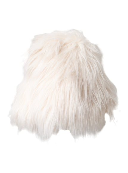 a white furry pillow on a white background