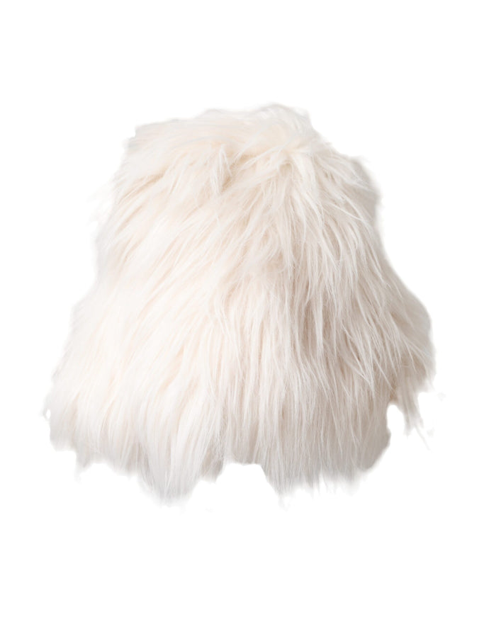 a white furry pillow on a white background