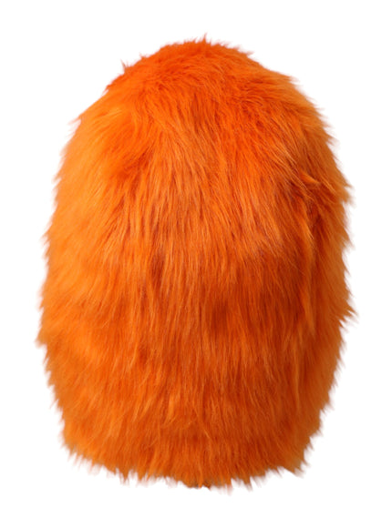 a bright orange furry ball on a white background