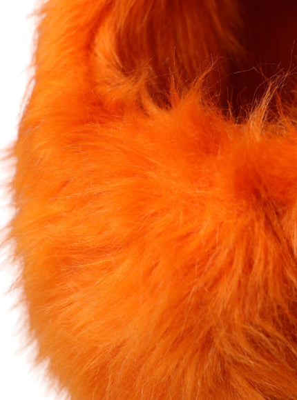 a close up of a furry orange object