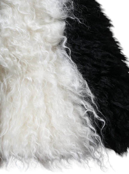 a close up of a black and white fur