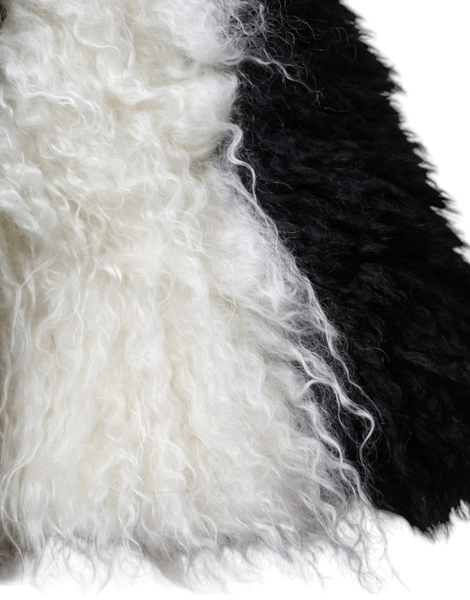 a close up of a black and white fur