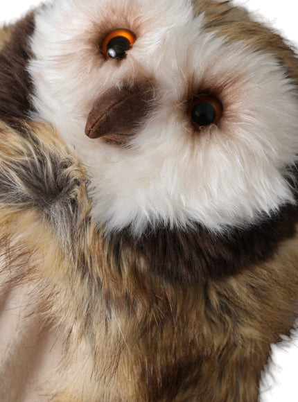 a stuffed owl with a brown and white face