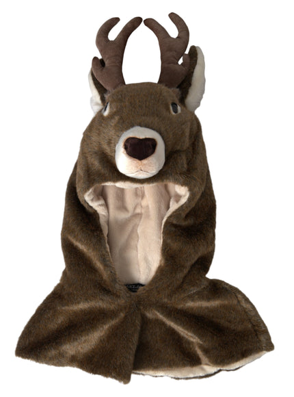 a stuffed animal wearing a blanket with antlers on it