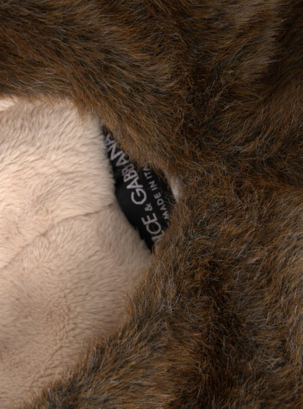 a close up of a teddy bear with a tag on it's ear