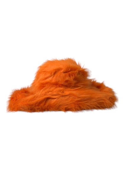 an orange furry animal hat on a white background