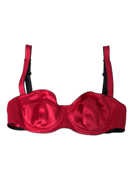 a red bra with black straps on a white background