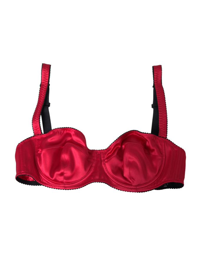 a red bra with black straps on a white background