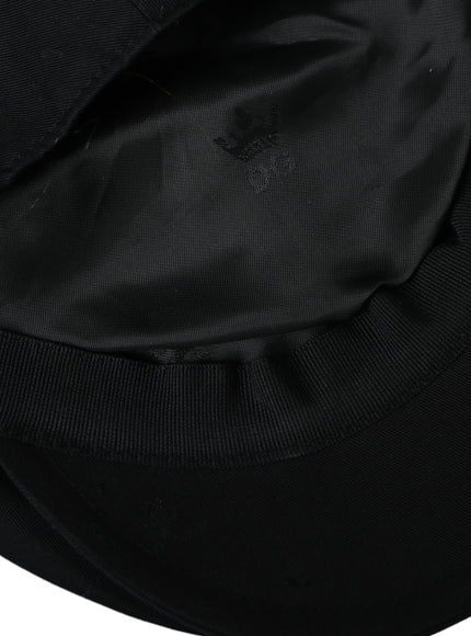 a close up of a black hat on a white background