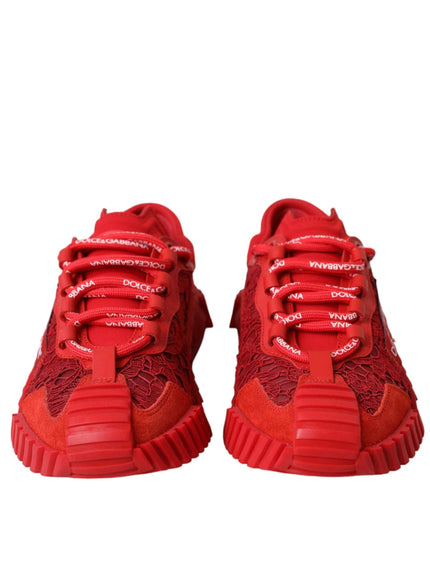 a pair of red sneakers on a white background